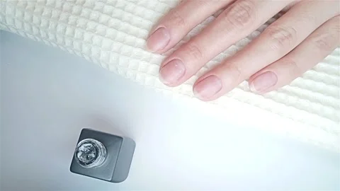 Gel polish manicure step-by-step video tutorial. Step 7 Nails base coat Stock Footage 278257378