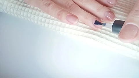 Gel polish manicure step-by-step video tutorial. Step 7 Nails base coat Video stock 279640388