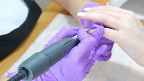 Gel polish removal process. Nail treatment apparatus, hardware manicure. Video stock 148231420
