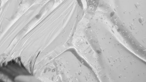 Gel serum with peptides texture spreading with brush footage. Liquid cosmetic Stock Footage 193994622