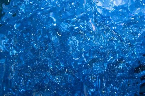 Gel structure on blue background, backdrop for cosnetuc product, soft focus.. Foto stock