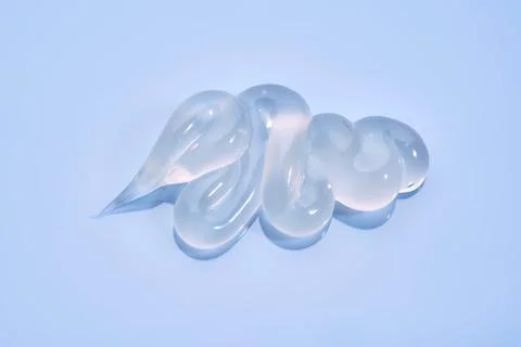 Gel toothpaste on a blue background. Stock Photos