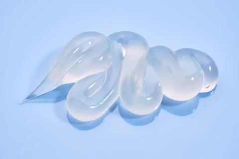 Gel toothpaste on a blue background. Stock Photos