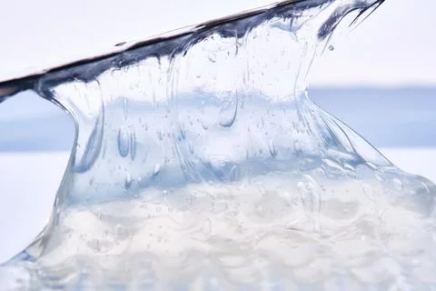 Gel toothpaste on a blue background. Stock Photos
