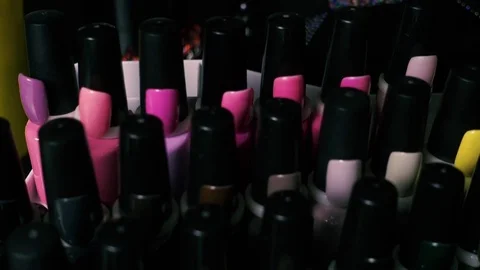 Gel varnish in bottles on the stand, camera movement Video stock 74011711
