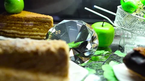 Gem lying among cakes Stock Footage 64899713