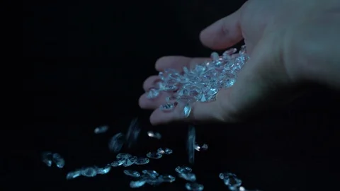 Gem stones dropping from hand Video stock 127219110