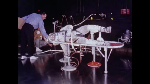 Gemini 10 astronaut Michael Collins training for EVA on air bearing floor Stock Footage 263444915