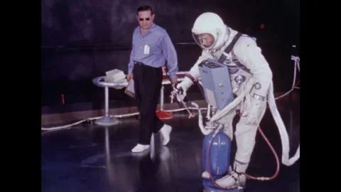 Gemini 10 astronaut Michael Collins training for EVA on air bearing floor Stock Footage 263445009