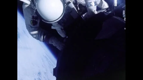 Gemini 12 astronaut Buzz Aldrin conducting extra-vehicular activity Stock Footage 263444602