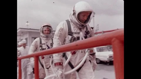 Gemini 8 crew Neil Armstrong and David Scott arriving at launchpad in spacesuits Video stock 263445119