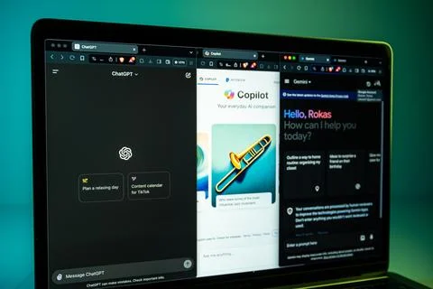 Gemini, Copilot, ChatGPT AI chatbots opened on separated windows on laptop Foto stock