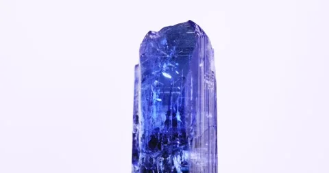 Gemmy tanzanite rotating on white background Stock Footage 269676519