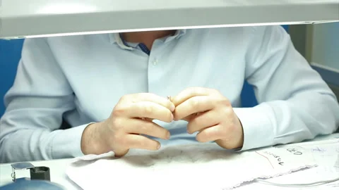 The gemologist checking the diamonds carat and quality diamond ring Stock Footage 139681915