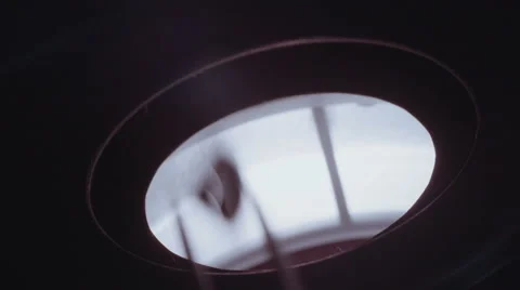 Gemologist using a microscope to inspect a large diamond Stock Footage 65260263