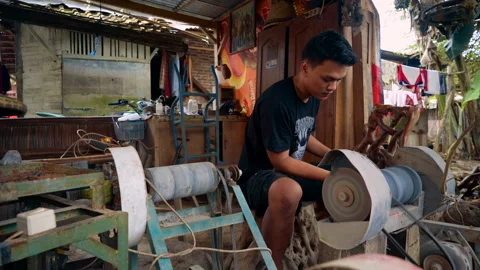 Gemstone craftsman using grinding machine Stock Footage 87185457