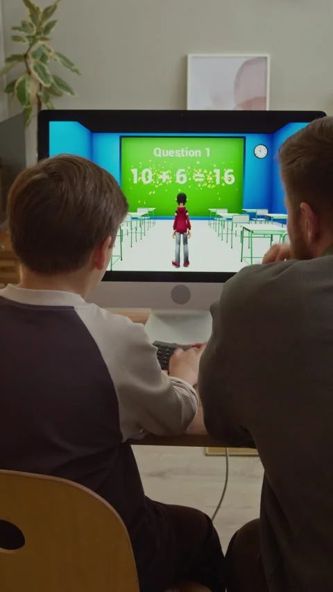 Gen Alpha Boy Playing Educational Game on Computer with Father at Home Stock Footage 332776235