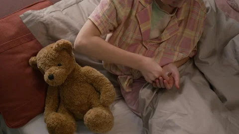 Gen Alpha Child Taking Blister Pack from Bedside Table and Putting Pill in Mouth Stock Footage 335468771
