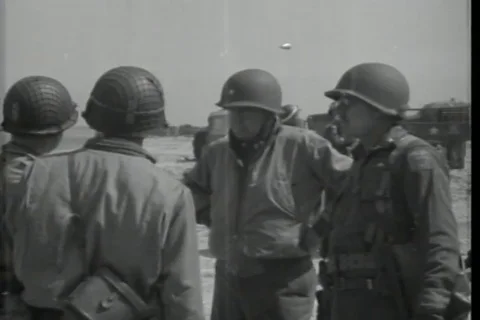 Gen Barton Montgomery and General J Lawton Collins chat on the beach - 1944 Stock Footage 93846682