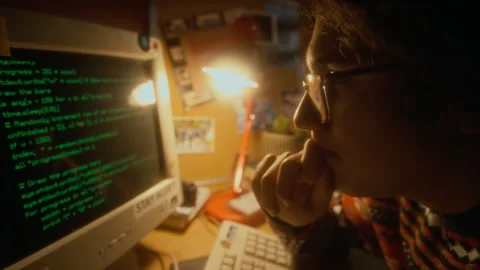 Gen Y Developer in Glasses Reading Programming Code on Old Computer in 90s Stock Footage 285992852