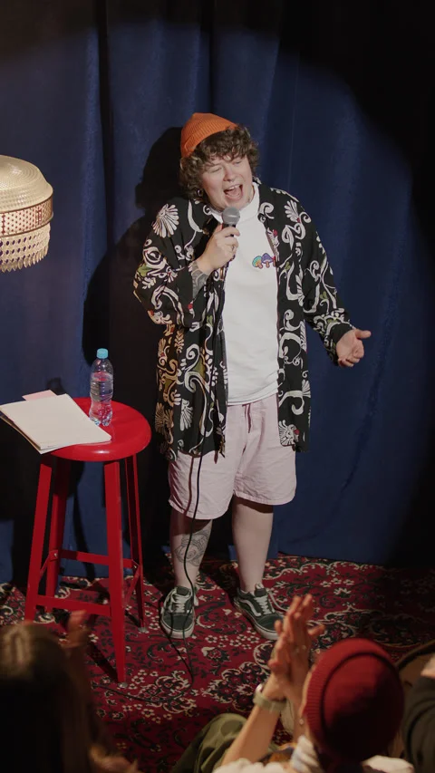 Gen Z Comic Performing Stand Up Monologue on Small Stage of Comedy Club Stock Footage 333228759