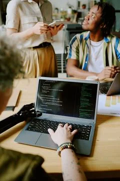 Gen Z Girl With Disability Coding In Office Foto stock