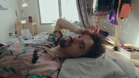Gen Z Guy Posing for Camera in Bedroom Stock Footage 235659117