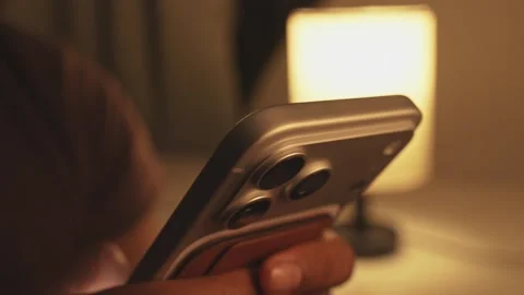 Gen Z hands using a smartphone in a light filled building interior, close up Stock Footage 333280362
