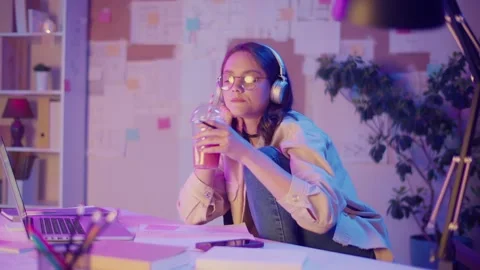 Gen Z Lifestyle, Creative Flow. Teen Girl Draws, Listens Music, Watches Screen Stock Footage 307069904