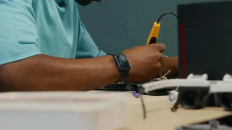 Gen Z Man Fixing CPU of Computer with Soldering Iron Stock Footage 300080118