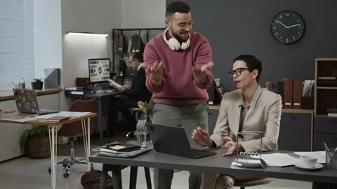 Gen Z Man Helping Elegant Middle-Aged Woman Fix Laptop Problem, She Thanking Him Stock Footage 330523746