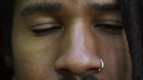 Gen Z Man With Locks and Nose Ring Blinks in Slow Motion Close Up 스톡 동영상 142011658