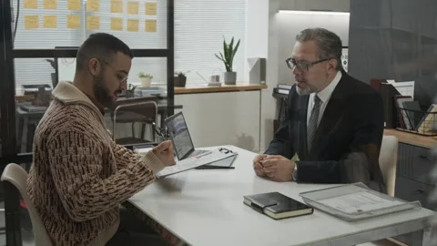 Gen Z Man Receiving Application Form from Male HR Specialist and Signing It Stock Footage 330518086