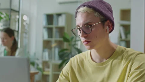Gen Z Office Worker Using Laptop at Desk | Stock Video | Pond5