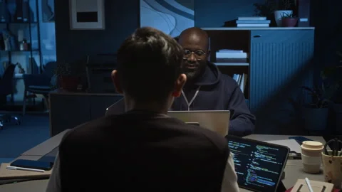 Gen Z Programmer Chatting with Millennial QA Specialist while Working on Laptops Stock Footage 329615948