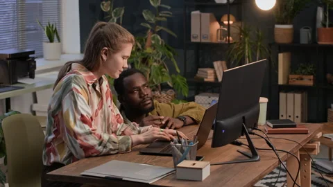 Gen Z Programmers Discussing App Developing Working on Digital Devices Video stock 302890832