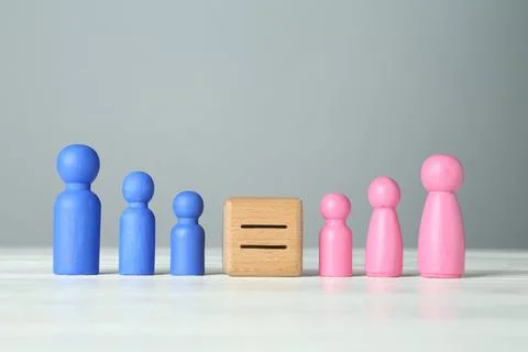 Gender equality concept. Cube with equals sign between male and female figu.. Stock Photos