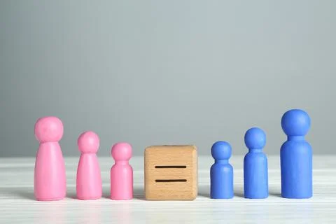 Gender equality concept. Cube with equals sign between male and female figu.. Stock Photos