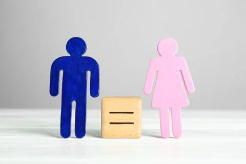 Gender equality concept. Cube with equals sign between male and female figu.. Stock Photos
