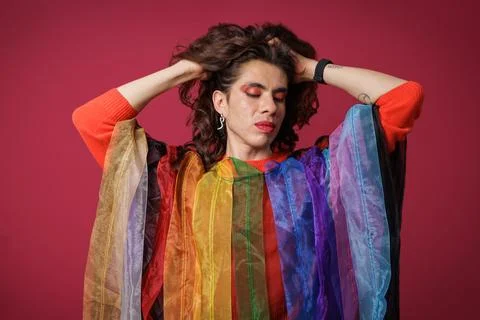 Genderqueer person posing in support of Pride Month, teasing and wearing Prid Stock Photos