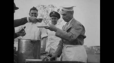 General Billy Mitchell serving barbecued beef to guest at farewell Stock Footage