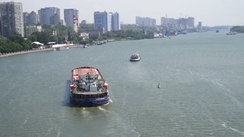 General cargo ship sails in city Stock Footage 222378411