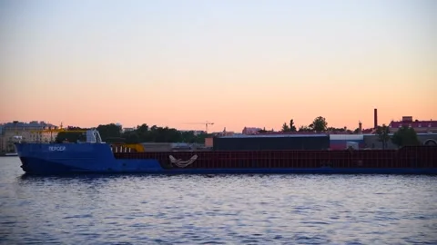 General cargo ship sails on river at sunrise Stock Footage 282391260