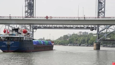 General cargo ship sails under bridge Stock Footage 221706573