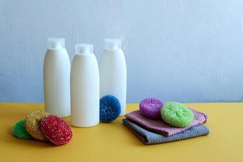 General cleaning time at home: sponges, napkins, bottles of detergents on a y Stock Photos