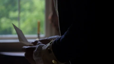 General George Washington reads documents in his dark headquarters Stock Footage 105825130