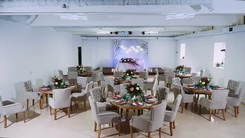 General interior plan of the restaurant with a flower decor and a honeymoon area Stock Footage 97720925