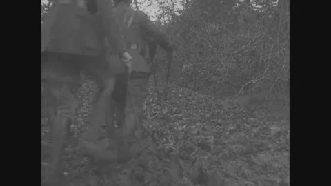 General Joseph Dickman inspect rubbled, solider watch artillery in action - 1918 Stock Footage 99962723