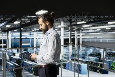 General manager manages code programming with tablet on industrial platform 스톡 사진