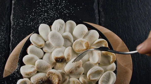 The general plan of the cake in slow-motion filming takes marshmallows Stock Footage 101732922